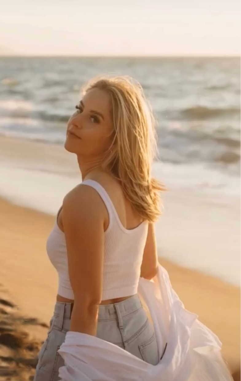 Lash extensions on woman walking on beach